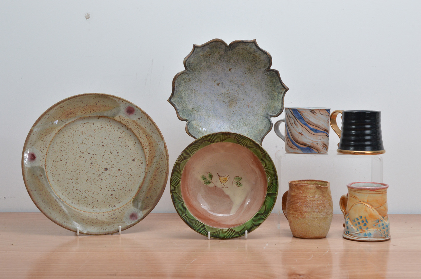 A collection of 20th century studio pottery kitchen items, comprising a stoneware glazed bowl by