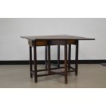 A 19th century oak primitive gate leg table, drop leaves, with two frieze drawers both with tear