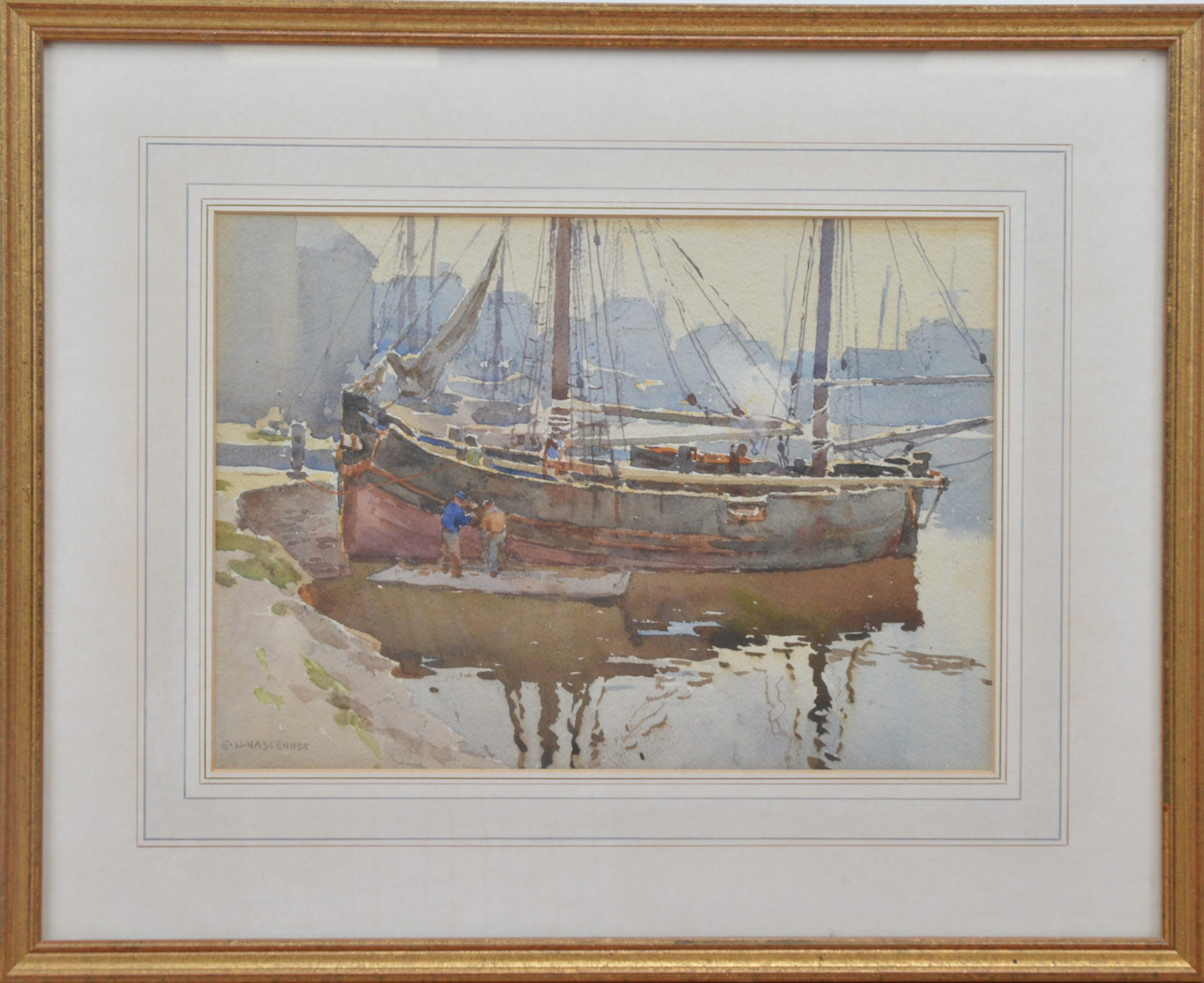 Ernest William Haslehurst (British 1866-1949), a boat in a harbour, watercolour on paper, signed