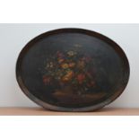 A 19th century large hand painted lacquer tray, oval shape, floral painted central design, some wear