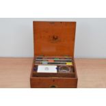 An early 20th century Reeves & Sons watercolour set, in a mahogany box, the underside of the lid
