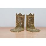 Two 20th century brass bookends, with griffins, both 17cm high (2)