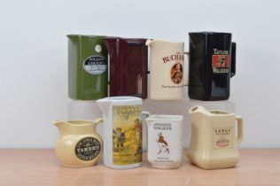 A collection of eight ceramic branded water jugs, comprising two Johnnie Walker, William Lawson's,