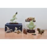 A collection of 20th century Chinese jade and hardstone sculptures, comprising a jade horse in a