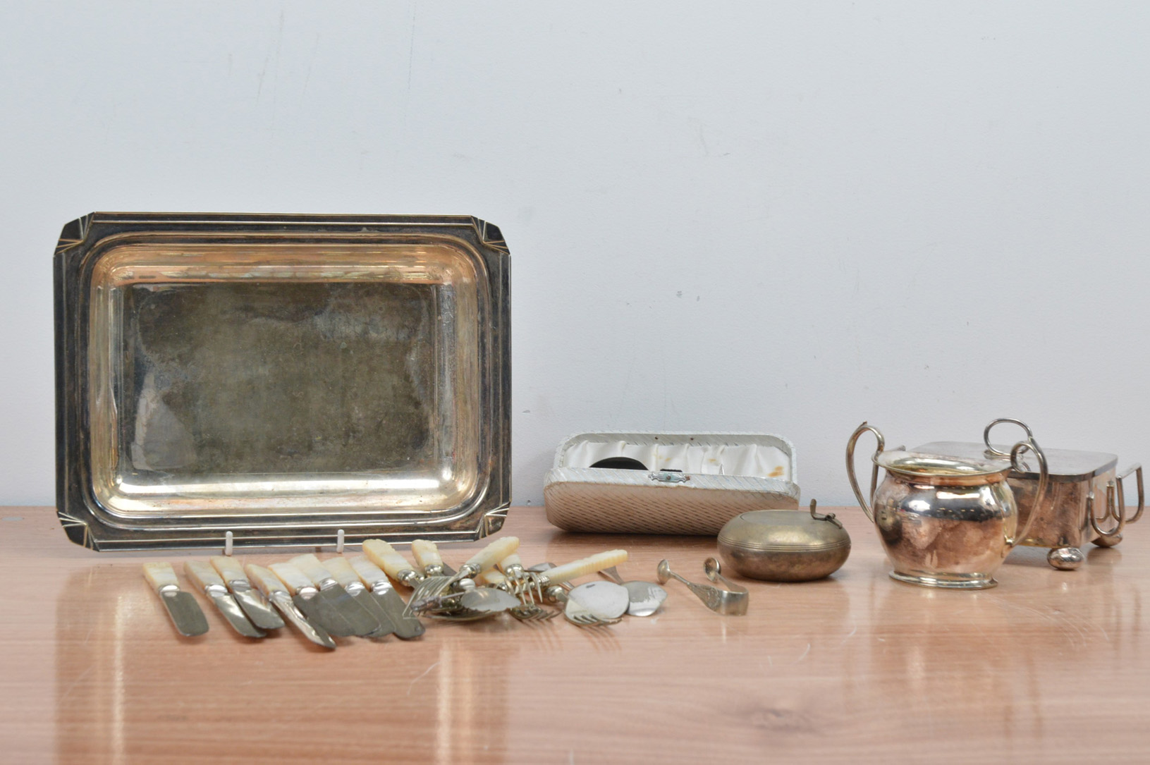 A collection of assorted silver plate and others, including fruit knives, a twin handled sugar bowl,