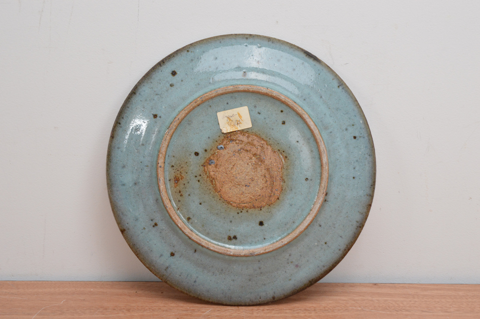 Attributed to Rupert Spira (British b. 1960), a stoneware plate with a green/blue mottled glaze, - Image 2 of 2