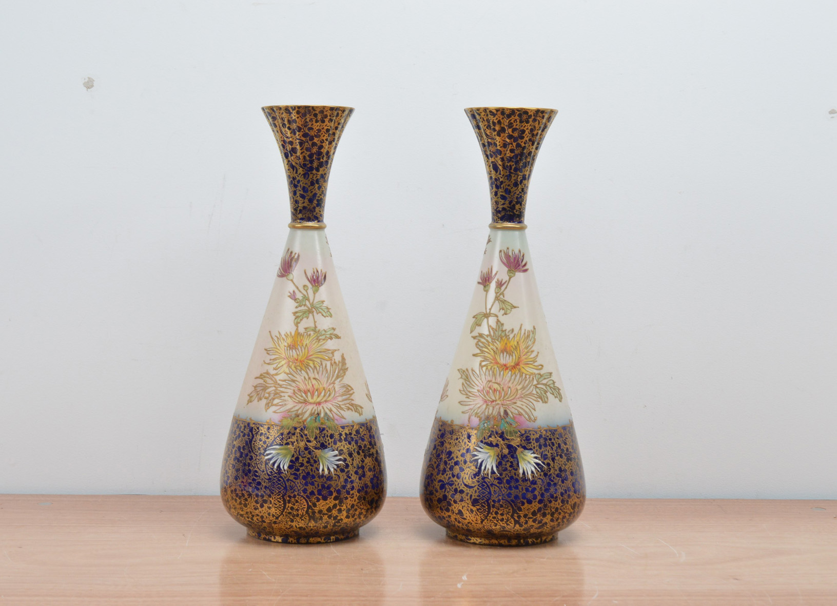 A pair of 20th century ceramic Carlton Ware vases, with floral designs, some minor condition
