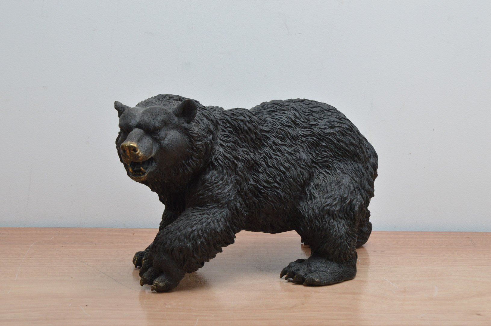 A bronze sculpture of a bear, with some minor wear, 38cm wide