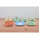 A collection of Shelley ceramics, mostly square plates, three with handles, of differing designs and