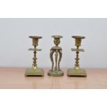 A pair of Victorian brass candlesticks, of classical form 17cm high, together with a further brass