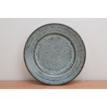 Attributed to Rupert Spira (British b. 1960), a stoneware plate with a green/blue mottled glaze,