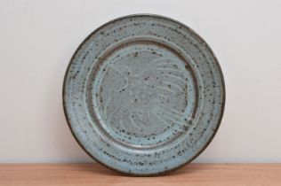 Attributed to Rupert Spira (British b. 1960), a stoneware plate with a green/blue mottled glaze,