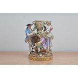 A 19th century Meissen porcelain figural group, of a man, woman and child surrounding a twin handled