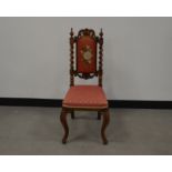 A Victorian gothic style walnut upholstered chair, barley twisted columns mounted with finials