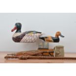 A collection of works of art, including two modern wooden decoy ducks, an African walking stick,