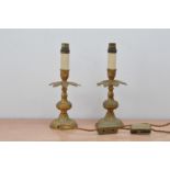 A pair of brass candlesticks, wired for electricity both 29cm high (2)