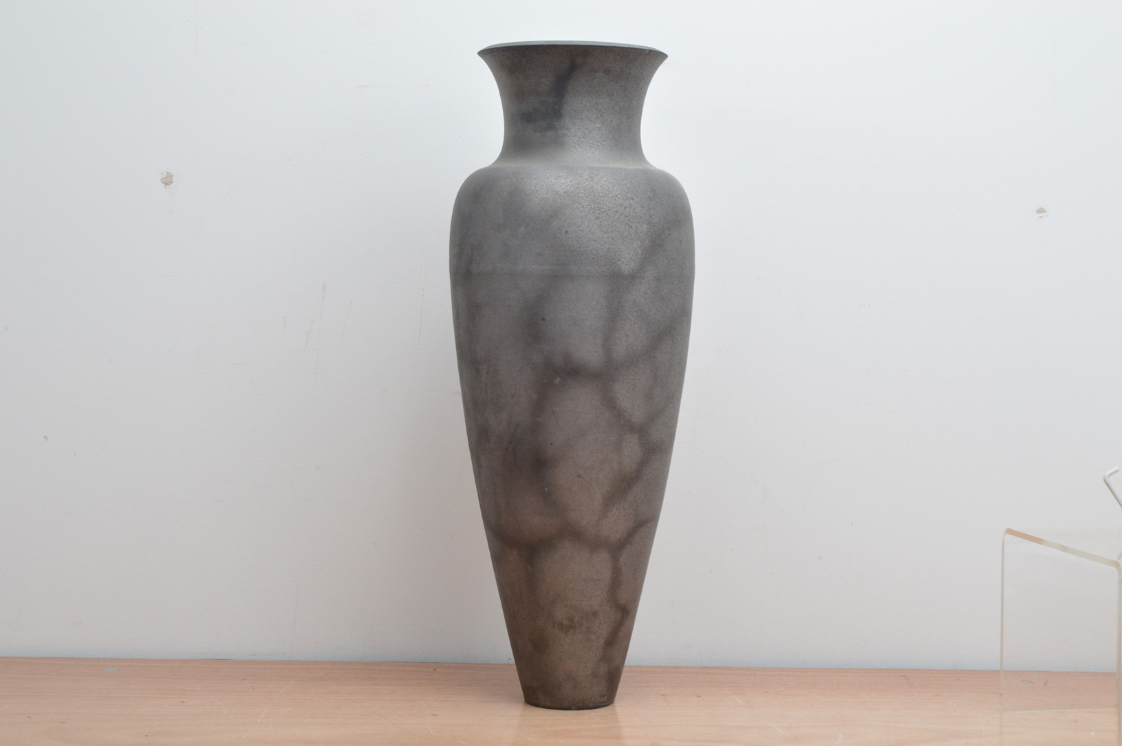 Keith Munro (British b. 1958), a tall ceramic vase, in the amphora classical style, black and