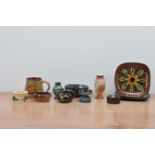 A collection of Guernsey studio pottery, including small plates, jugs, a small vase, etc, the