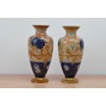 A pair of Doulton Lambeth stoneware vases, blue and brown decoration, both with impressed marks to