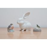 Two porcelain Royal Copenhagen animal figurines, comprising a bird and frog on a rock, both marked