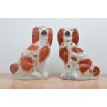 A pair of large 19th century Staffordshire ceramic dogs, with some wear to the paint and gilt