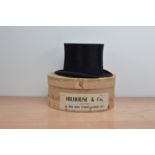A silk top hat, by Hillouse & Co., width 6 1/4in., in a retail cardboard box