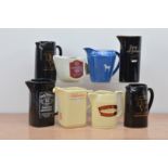A collection of eight ceramic branded water jugs, comprising Two Black Velvet, Long John, Chivas