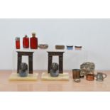 A collection of works of art, including silver topped coloured glass scent bottles, a pair of