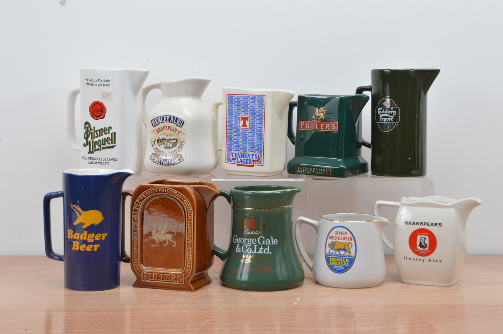 A collection of ten ceramic beer branded water jugs, including, Henley Ales, Badger Beer, Fullers