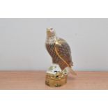 A Royal Crown Derby bone china paperweight of a Sea Eagle, 21cm high, with a gold stopper