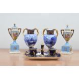 Two pairs of 20th century porcelain vases, one pair in a classical style with covers (both AF),