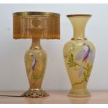 Two modern opaque glass vases, both with gilt rims and a hand painted bird design, signed