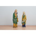 A pair of late 19th/early 20th century Chinese terracotta tomb figurines, both of bearded men,