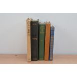 A collection of Rudyard Kipling books, including Kim, From Sea to Sea, Thy Servant a Dog, worn