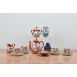 A collection of Japanese export porcelain items, comprising a tea set, vases and a small jar with