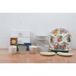 A mixed collection of ceramics, including jelly moulds, kidney shaped dishes, a German modern