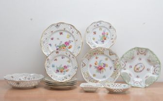 A collection of 20th century German ceramic items, all with reticulated pierced borders and floral