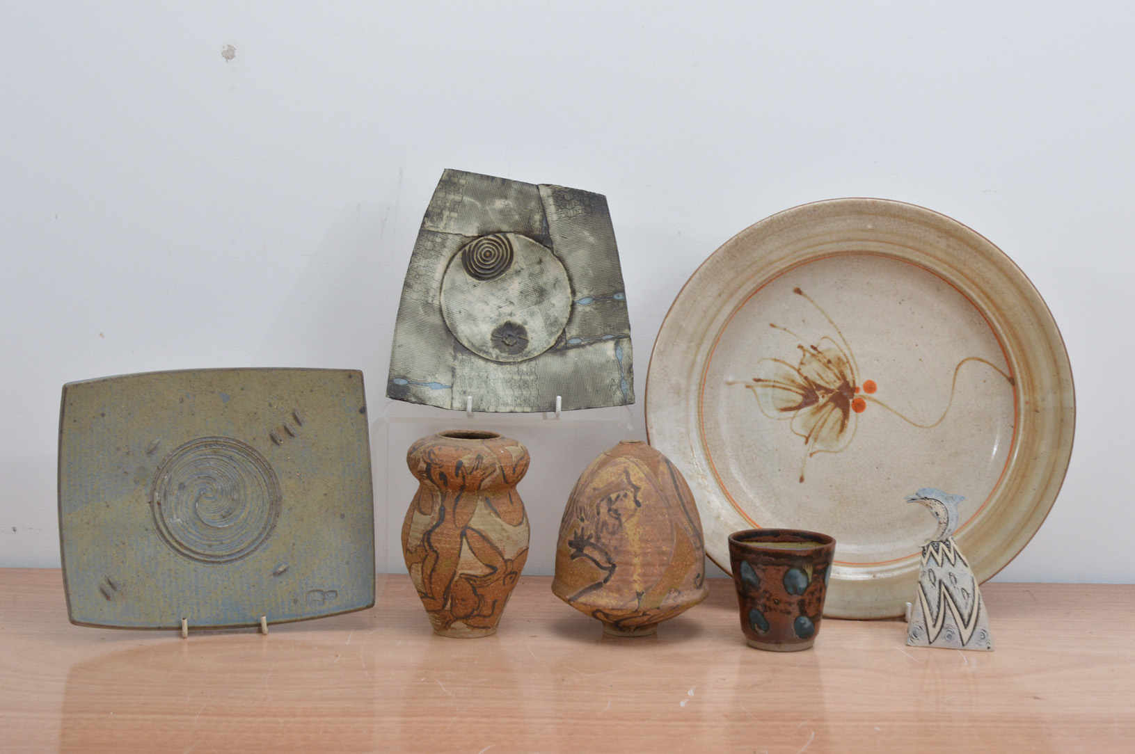 A collection of 20th century studio pottery, comprising two stoneware brown glazed vessels by