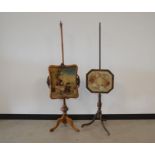 Two Victorian pole screens, both wooden, one with scrolling designs and shaped square needlework