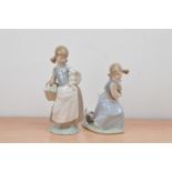 Two Llodra ceramic figurines, one of girl with a lamb, the other a girl with a dog, both marked to