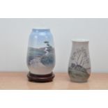 One Royal Copenhagen porcelain vase, the other B&G, of differing sizes, with landscape scenes, one