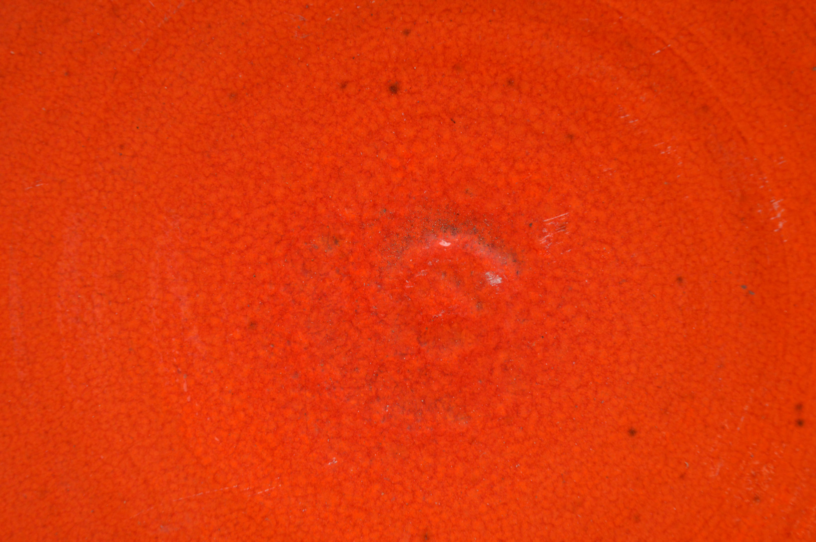 A 20th century Italian stoneware charger, vermillion mottled glaze with a ribbed center, with wall - Image 2 of 2