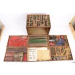Collection of playwormn Pre and Post-War Meccano in 15'' x 10'' six drawer cabinet, incl green,