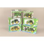 ERTL Diecast 1:32 Scale John Deere Tractors and Farm Machinery, a boxed group, tractors 5668 model