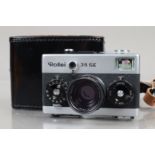 A Rollei 35 SE Compact Camera, chrome, made in Singapore, shutter working, not battery checked, body