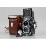 A Rolleiflex 2.8E TLR Camera, serial no 1650356, shutter working, meter responsive, body G, light