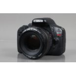 A Canon EOS Rebel T2i DSLR Camera, serial no 0322101213, powers up, shutter working, appears to