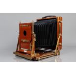 A Gandolfi Mahogany and Brass Whole Plate Camera brass bound, possibly 1970s, with 8½ x 6½ in