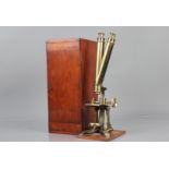 A late 19th Century unnamed lacquered brass Wenham Binocular Microscope, with two eyepieces,