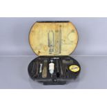 A vintage Jaguar MkII tool kit, to include spanners, an adjustable spanner, hand pump, spark plug